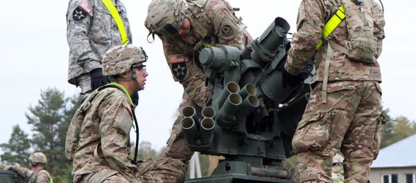 Members of the US Army 1st Brigade, 1st Cavalry Division, prepare Stryker Armored Vehicles at the railway station near the Rukla military base in Lithuania. (File) - Sputnik International