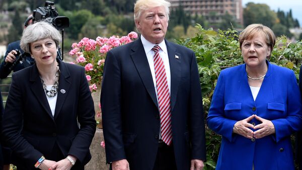 (L-R) Britain's Prime Minister Theresa May, U.S. President Donald Trump and German Chancellor Angela Merkel arrive to watch an Italian flying squadron as part of activities at the G7 Summit in Taormina, Sicily, Italy, May 26, 2017. - Sputnik International