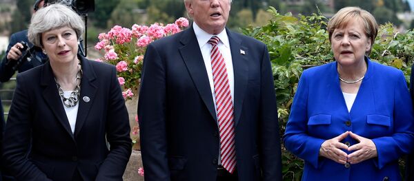 (L-R) Britain's Prime Minister Theresa May, U.S. President Donald Trump and German Chancellor Angela Merkel arrive to watch an Italian flying squadron as part of activities at the G7 Summit in Taormina, Sicily, Italy, May 26, 2017. (L-R) Britain's Prime Minister Theresa May, U.S. President Donald Trump and German Chancellor Angela Merkel arrive to watch an Italian flying squadron as part of activities at the G7 Summit in Taormina, Sicily, Italy, May 26, 2017. - Sputnik International