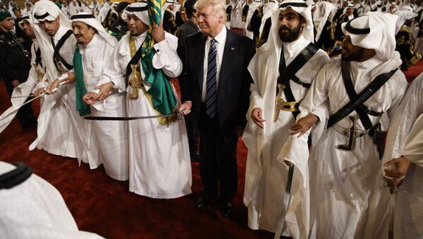 President Donald Trump holds a sword and sways with traditional dancers during a welcome ceremony at Murabba Palace in Riyadh - Sputnik International