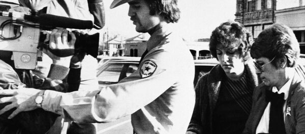 In this Feb. 16, 1984, file photo, Genene Jones, second right, is escorted into Williamson County Courthouse in Georgetown, Texas. Jones, a former nurse who's been serving a 99-year prison sentence since 1984 for the fatal overdose of an infant in her care, is due for early release in March 2018. - Sputnik International