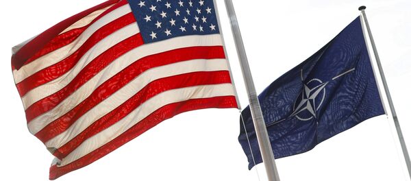 NATO and U.S. flags fly at the entrance of the Alliance's headquarters during a NATO foreign ministers meeting in Brussels, Belgium March 31, 2017 NATO and U.S. flags fly at the entrance of the Alliance's headquarters during a NATO foreign ministers meeting in Brussels, Belgium March 31, 2017 - Sputnik International