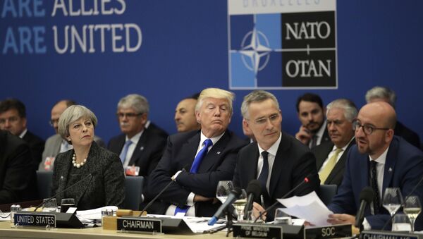 British Prime Minister Theresa May, U.S. President Donald Trump and NATO Secretary General Jens Stoltenberg listen to Belgian Prime Minister Charles Michel as he speaks during a working dinner meeting at the NATO headquarters during a NATO summit of heads of state and government in Brussels on Thursday, May 25, 2017 - Sputnik International