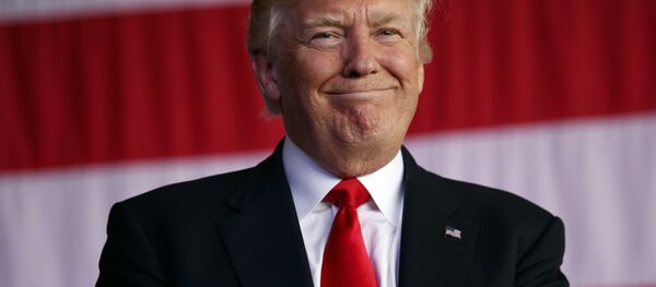 Trump smiles as he is introduced to speak to U.S. military troops and their families at Naval Air Station Sigonella, Saturday, May 27, 2017, in Sigonella, Italy. - Sputnik International