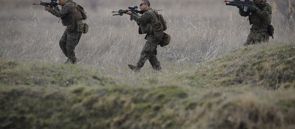 US Marines advance on the Black Sea shore during training at the Capu Midia Surface to Air Firing Range, on the Black Sea coast in Romania US Marines advance on the Black Sea shore during training at the Capu Midia Surface to Air Firing Range, on the Black Sea coast in Romania - Sputnik International