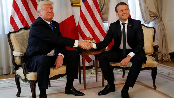 U.S. President Donald Trump (L) and French President Emmanuel Macron shake hands before a lunch ahead of a NATO Summit in Brussels, Belgium, May 25, 2017 - Sputnik International