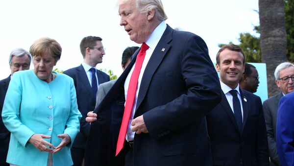German Chancellor Angela Merkel, U.S. President Donald Trump and French President Emmanuel Macron during a family photo at the G7 Summit expanded session in Taormina, Sicily, Italy, May 27, 2017 - Sputnik International