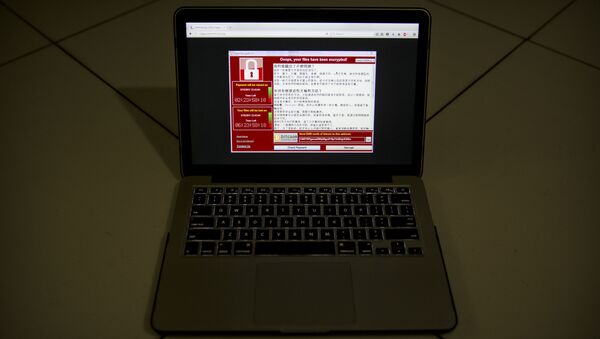 A screenshot of the warning screen from a purported ransomware attack, as captured by a computer user in Taiwan, is seen on laptop in Beijing, Saturday, May 13, 2017. - Sputnik International