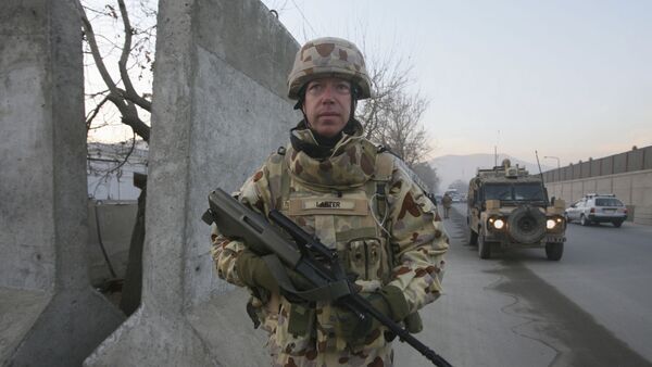 An Australian soldier Mark Larter with the International Security Assistant Force walks during a patrolling on Christmas day in Kabul, Afghanistan, on Thursday, Dec. 25, 2008 - Sputnik International
