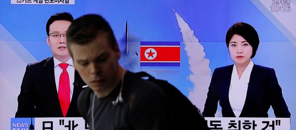 People watch a television broadcasting a news report on North Korea firing what appeared to be a short-range ballistic missile, at a railway station in Seoul, South Korea, May 29, 2017 - Sputnik International