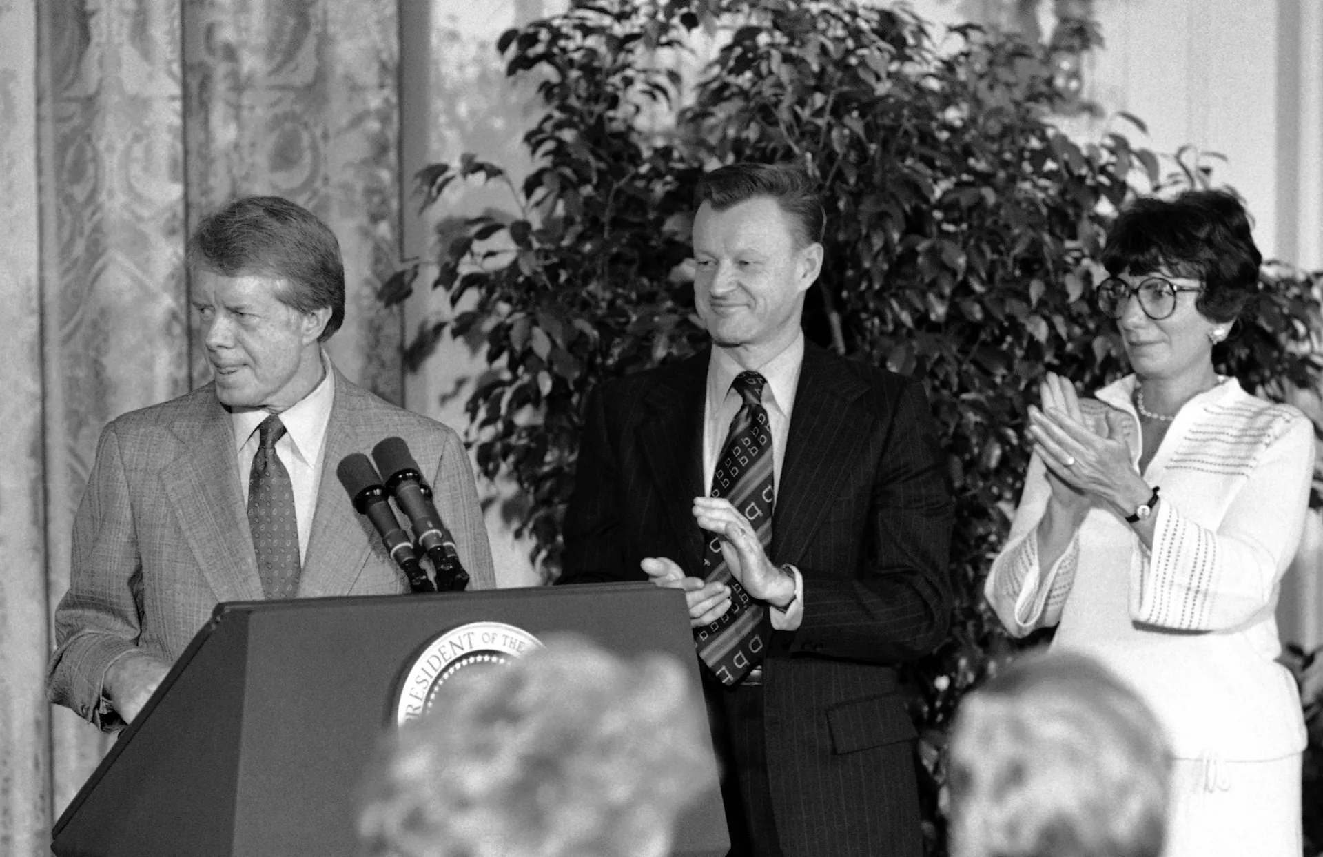 President Jimmy Carter, claiming success for his human rights policies, is applauded by aides Zbigniew Brzezinski and Anne Wexler in Washington, Dec. 6, 1978 - Sputnik International, 1920, 05.10.2024