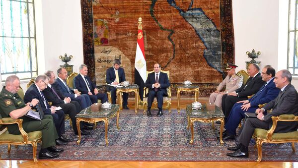 Egyptian President Abdel Fattah al-Sisi (C) meets with Russian Foreign Minister Sergei Lavrov (4th L), Russian Defence Minister Sergei Shoigu (5th L) and other delegates from Egypt and Russia at the Ittihadiya presidential palace in Cairo, Egypt May 29, 2017 in this handout picture courtesy of the Egyptian Presidency - Sputnik International