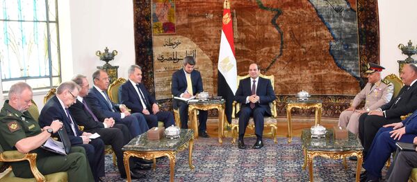 Egyptian President Abdel Fattah al-Sisi (C) meets with Russian Foreign Minister Sergei Lavrov (4th L), Russian Defence Minister Sergei Shoigu (5th L) and other delegates from Egypt and Russia at the Ittihadiya presidential palace in Cairo, Egypt May 29, 2017 in this handout picture courtesy of the Egyptian Presidency - Sputnik International