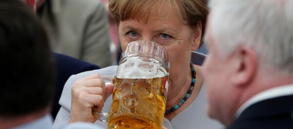 German Chancellor and head of the Christian Democratic Union (CDU) Angela Merkel drinks during the Trudering festival in Munich, Germany, May 28, 2017 - Sputnik International