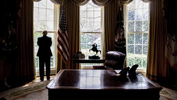In this photo taken April 21, 2017, President Donald Trump looks out an Oval Office window at the White House in Washington following an interview with The Associated Press - Sputnik International