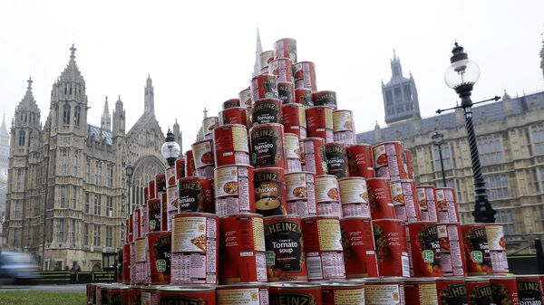 A pyramid of 468 cans of soup during a media event outside the Palace of Westminster to highlight food bank dependency. - Sputnik International