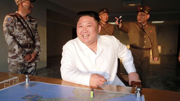 North Korean leader Kim Jong Un reacts during a ballistic rocket test-fire through a precision control guidance system in this undated photo released by North Korea's Korean Central News Agency (KCNA) May 30, 2017 - Sputnik International