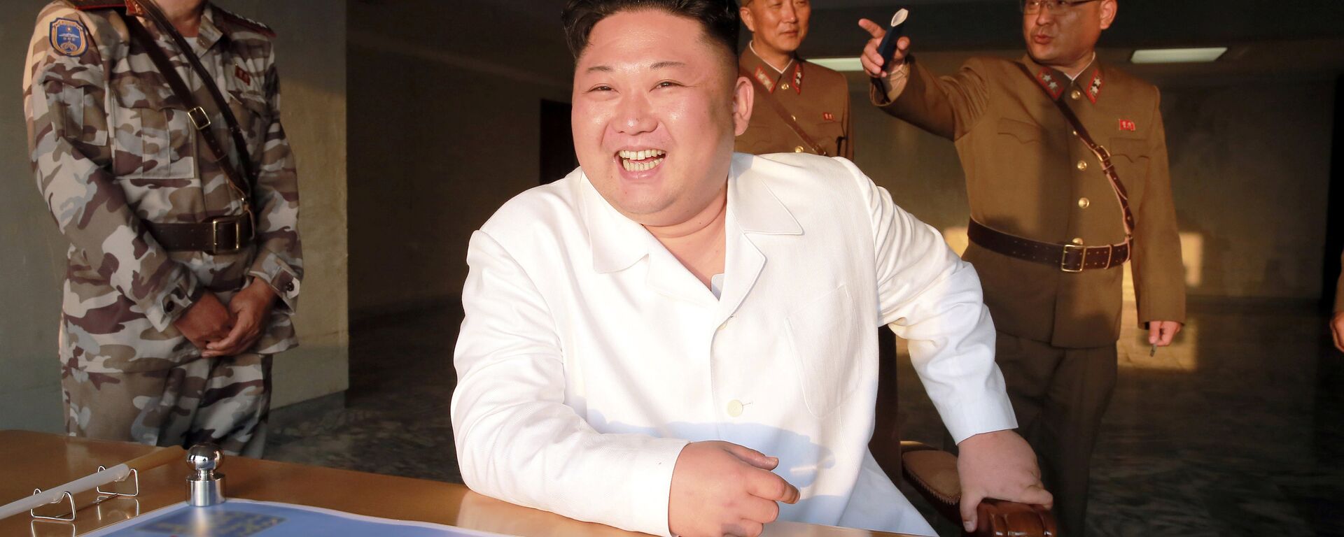 North Korean leader Kim Jong Un reacts during a ballistic rocket test-fire through a precision control guidance system in this undated photo released by North Korea's Korean Central News Agency (KCNA) May 30, 2017 - Sputnik International, 1920, 30.05.2017