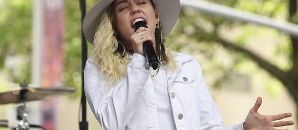 FILE - In this May 26, 2017 file photo, singer Miley Cyrus performs on NBC's Today show in New York. Cyrus will join Ariana Grande at a charity concert called One Love Manchester in Manchester, England, Sunday, June 3, 2017, two weeks after a bomber killed 22 people at Grande's concert in Manchester FILE - In this May 26, 2017 file photo, singer Miley Cyrus performs on NBC's Today show in New York. Cyrus will join Ariana Grande at a charity concert called One Love Manchester in Manchester, England, Sunday, June 3, 2017, two weeks after a bomber killed 22 people at Grande's concert in Manchester - Sputnik International