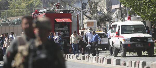 Security forces and medics work the site of a suicide attack in Kabul, Afghanistan - Sputnik International