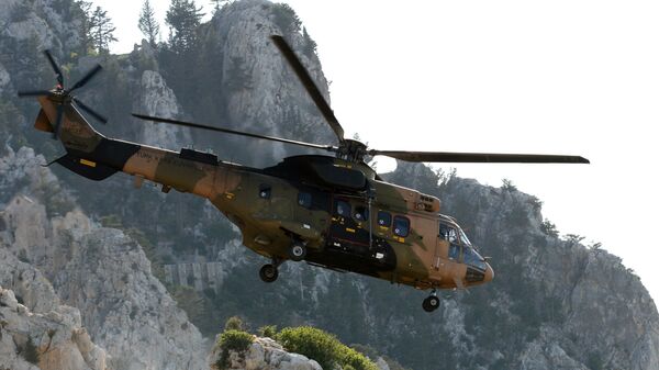 A Turkish army Cougar helicopter flies over the Saint-Hilarion mountain shane near Kyrenia during a search and rescue exercise in northern Cyprus, Tuesday, June 16, 2009 amid a dispute with Greek Cypriots over oil and gas exploration off the island.  - Sputnik International