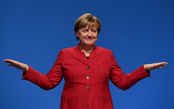 German Chancellor Angela Merkel gestures after addressing delegates during her conservative Christian Democratic Union (CDU) party's congress in Essen, western Germany, on December 6, 2016. German Chancellor Angela Merkel gestures after addressing delegates during her conservative Christian Democratic Union (CDU) party's congress in Essen, western Germany, on December 6, 2016. - Sputnik International