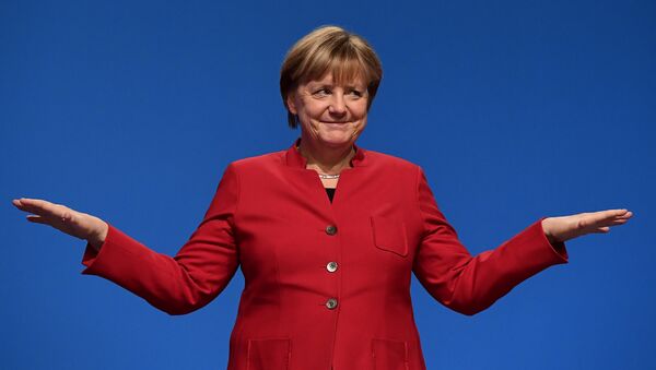 German Chancellor Angela Merkel gestures after addressing delegates during her conservative Christian Democratic Union (CDU) party's congress in Essen, western Germany, on December 6, 2016. - Sputnik International