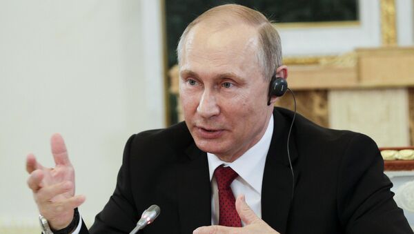Russian President Vladimir Putin speaks during a meeting with representatives of international news agencies in St. Petersburg, Russia, June 1, 2017. - Sputnik International