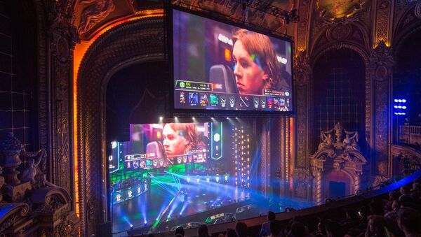 Screens display Ludwig Wåhlberg, player for EG team, during a semifinal match against OG team at the Boston Major Dota 2 tournament at the Wang Theatre in Boston. (File) - Sputnik International