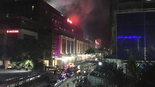 Smoke rises from the Resorts World Manila complex early Friday, June 2, 2017 in Manila, Philippines. - Sputnik International