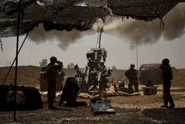 In this April 17, 2017 file photo, U.S. soldiers from the 82nd Airborne Division fire artillery in support of Iraqi forces fighting Islamic State militants from their base east of Mosul. In this April 17, 2017 file photo, U.S. soldiers from the 82nd Airborne Division fire artillery in support of Iraqi forces fighting Islamic State militants from their base east of Mosul. - Sputnik International