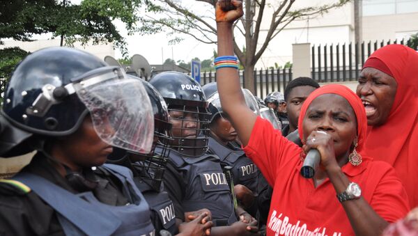 Police women in riot gear block the route during a demonstration calling on the government to rescue the kidnapped girls of the government secondary school in Chibok, in Abuja, Nigeria, Tuesday, Oct. 14, 2014. - Sputnik International