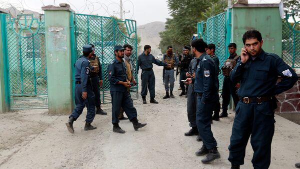 Afghan policemen stand guard near the site of blasts in Kabul, Afghanistan - Sputnik International