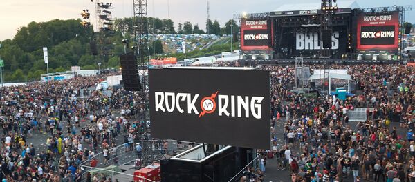 Festival goers leave the venue of the Rock am Ring music festival in June 2, 2017 in Nuerburg following an evcuation alert amid a possible 'terrorist threat'. Festival goers leave the venue of the Rock am Ring music festival in June 2, 2017 in Nuerburg following an evcuation alert amid a possible 'terrorist threat'. - Sputnik International