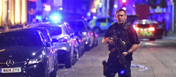An armed police stands on Borough High Street as police are dealing with an incident on London Bridge in London, Saturday, June 3, 2017. An armed police stands on Borough High Street as police are dealing with an incident on London Bridge in London, Saturday, June 3, 2017. - Sputnik International