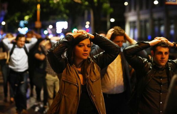 People leave the area with their hands up after an incident near London Bridge in London, Britain June 4, 2017 People leave the area with their hands up after an incident near London Bridge in London, Britain June 4, 2017 - Sputnik International