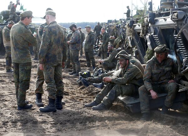 German army soldiers rest after NATO enchanced Forward Presence Battle Group Lithuania exercise in Pabrade military training field, Lithuania, May 17, 2017 German army soldiers rest after NATO enchanced Forward Presence Battle Group Lithuania exercise in Pabrade military training field, Lithuania, May 17, 2017 - Sputnik International