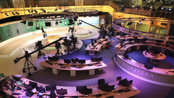 Staff members of Al-Jazeera International work at the news studio in Doha, Qatar (File) - Sputnik International