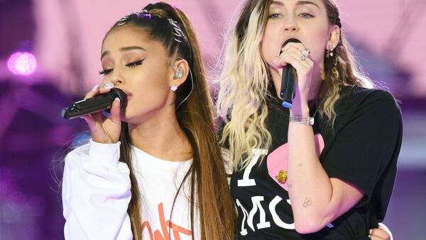 In this Sunday, June 4, 2017, handout photo provided by Dave Hogan for One Love Manchester, singers Ariana Grande, left, and Miley Cyrus perform at the One Love Manchester tribute concert in Manchester, north western England, Sunday, June 4, 2017. - Sputnik International