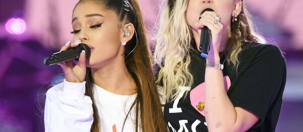 In this Sunday, June 4, 2017, handout photo provided by Dave Hogan for One Love Manchester, singers Ariana Grande, left, and Miley Cyrus perform at the One Love Manchester tribute concert in Manchester, north western England, Sunday, June 4, 2017. In this Sunday, June 4, 2017, handout photo provided by Dave Hogan for One Love Manchester, singers Ariana Grande, left, and Miley Cyrus perform at the One Love Manchester tribute concert in Manchester, north western England, Sunday, June 4, 2017. - Sputnik International
