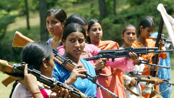 Women Village Defense Committee (VDC) members look on during a training session by the Indian Army at Sariya village, in Naushera sector, about 140 kilometers (88 miles) northwest of Jammu, India (File) - Sputnik International