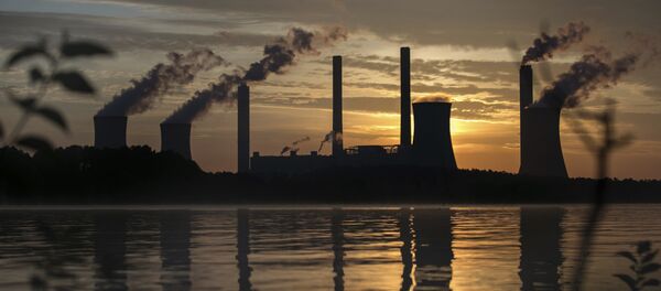 The coal-fired Plant Scherer, one of the nation's top carbon dioxide emitters, stands in the distance in Juliette, Ga., Saturday, June, 3, 2017 - Sputnik International