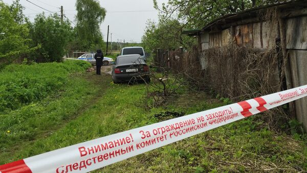 A police tape outside a house in Redkino gardening community in the Tver Region where a man shot down nine persons during a domestic conflict on the night of June 4 - Sputnik International