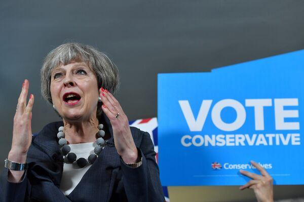 Britain's Prime Minister Theresa May delivers a speech during an election campaign visit to Langton Rugby Club in Stoke-on-Trent, June 6, 2017. Britain's Prime Minister Theresa May delivers a speech during an election campaign visit to Langton Rugby Club in Stoke-on-Trent, June 6, 2017. - Sputnik International