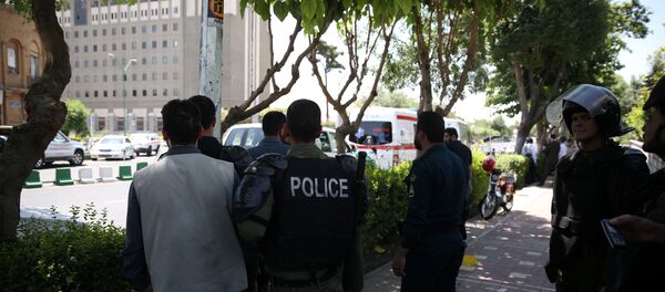 Iranian police stand near the parliament's building during a gunmen attack in central Tehran, Iran, June 7, 2017 - Sputnik International