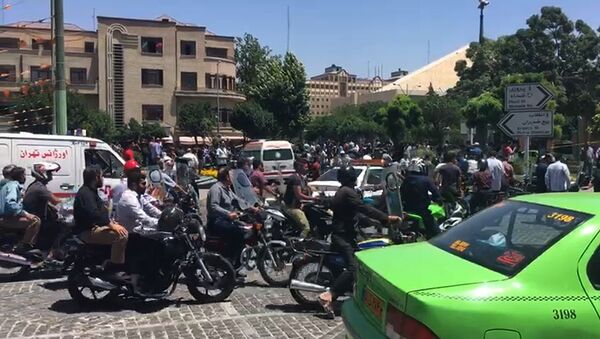 An image grab taken from AFPTV shows the scene outside the mausoleum of Ayatollah Ruhollah Khomeini, the late founder of the Islamic republic, in Tehran's southern suburb of Mossala, during an attack on the complex on June 7, 2017 - Sputnik International