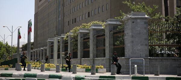 Members of Iranian forces run during a gunmen attack at the parliament's building in central Tehran, Iran, June 7, 2017 Members of Iranian forces run during a gunmen attack at the parliament's building in central Tehran, Iran, June 7, 2017 - Sputnik International