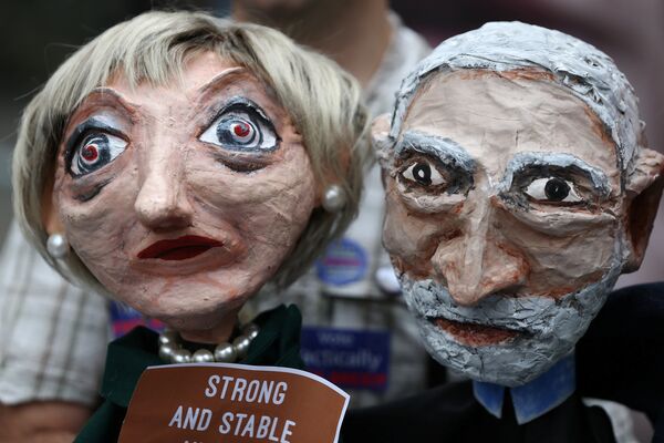 Puppets of Conservative Party leader Theresa May and Labour Party leader Jeremy Corbyn are seen during a protest against the BBC's broadcast restrictions on the Captain Ska song Liar Liar outside Broadcasting House in London, Britain June 2, 2017.  - Sputnik International