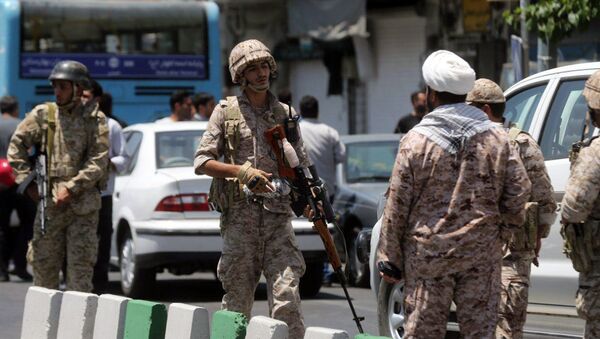 Members of the Iranian Revolutionary Guard secure the area outside the Iranian parliament during an attack on the complex in the capital Tehran on June 7, 2017 - Sputnik International