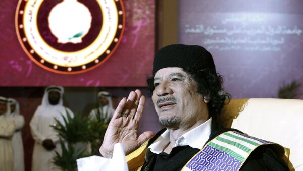 Libyan leader Moammar Gadhafi gestures during the Arab summit in Doha, Qatar, Monday, March 30, 2009 - Sputnik International